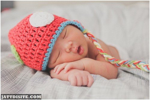 Baby In Colourful Cap
