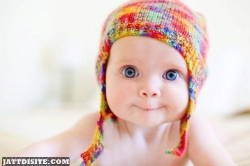 Blue Eyes Baby In Colourful Cap
