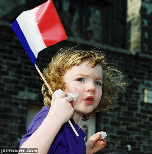 Cute Child With Flag On Bastille Day