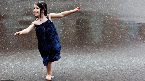 Little Cute Girl Playing In Rain