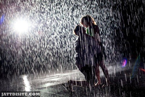 Loving Couple In Rain