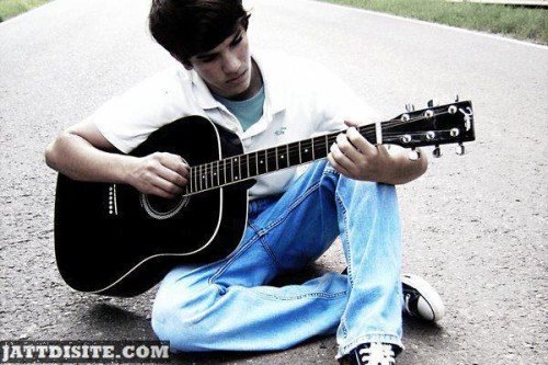 Alone Boy Sitting Playing Guitar