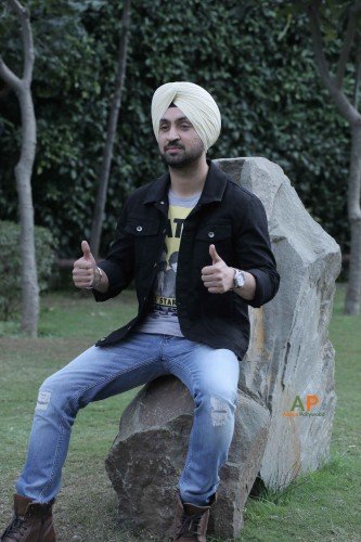 Diljit Dosanjh Sitting On Rock