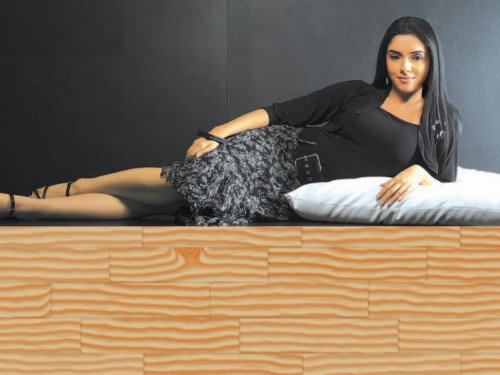 Actress Asin Lying On Bed Wallpaper