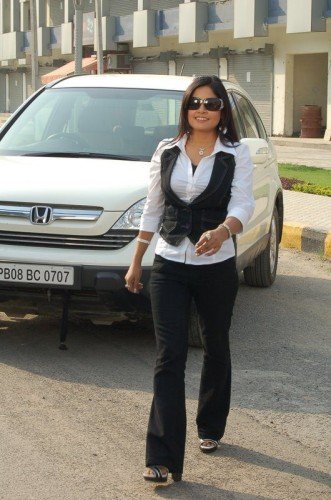 Miss Pooja Near Car